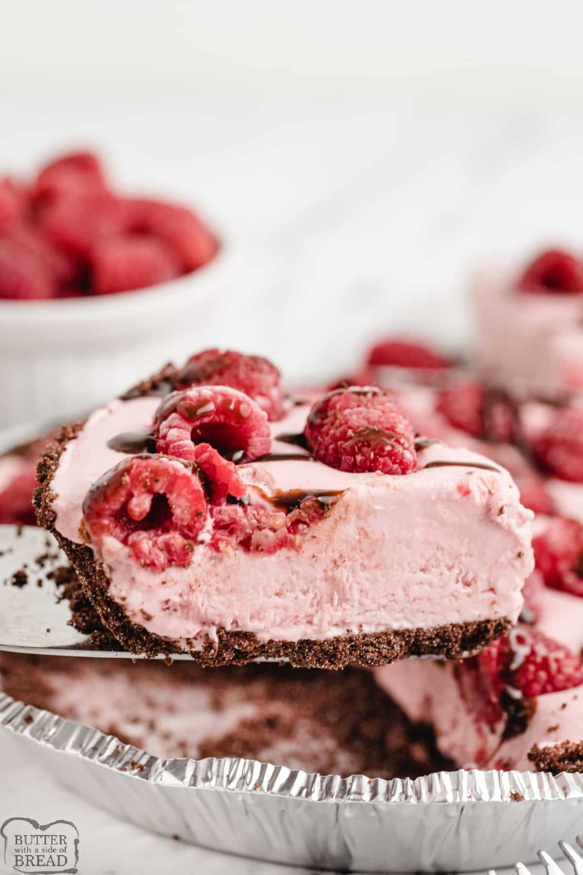 Frozen Raspberry Pie is a refreshing dessert that's perfect for summer. Made with fresh raspberries, an Oreo crust and real whipped cream, this frozen dessert is absolutely delicious!
