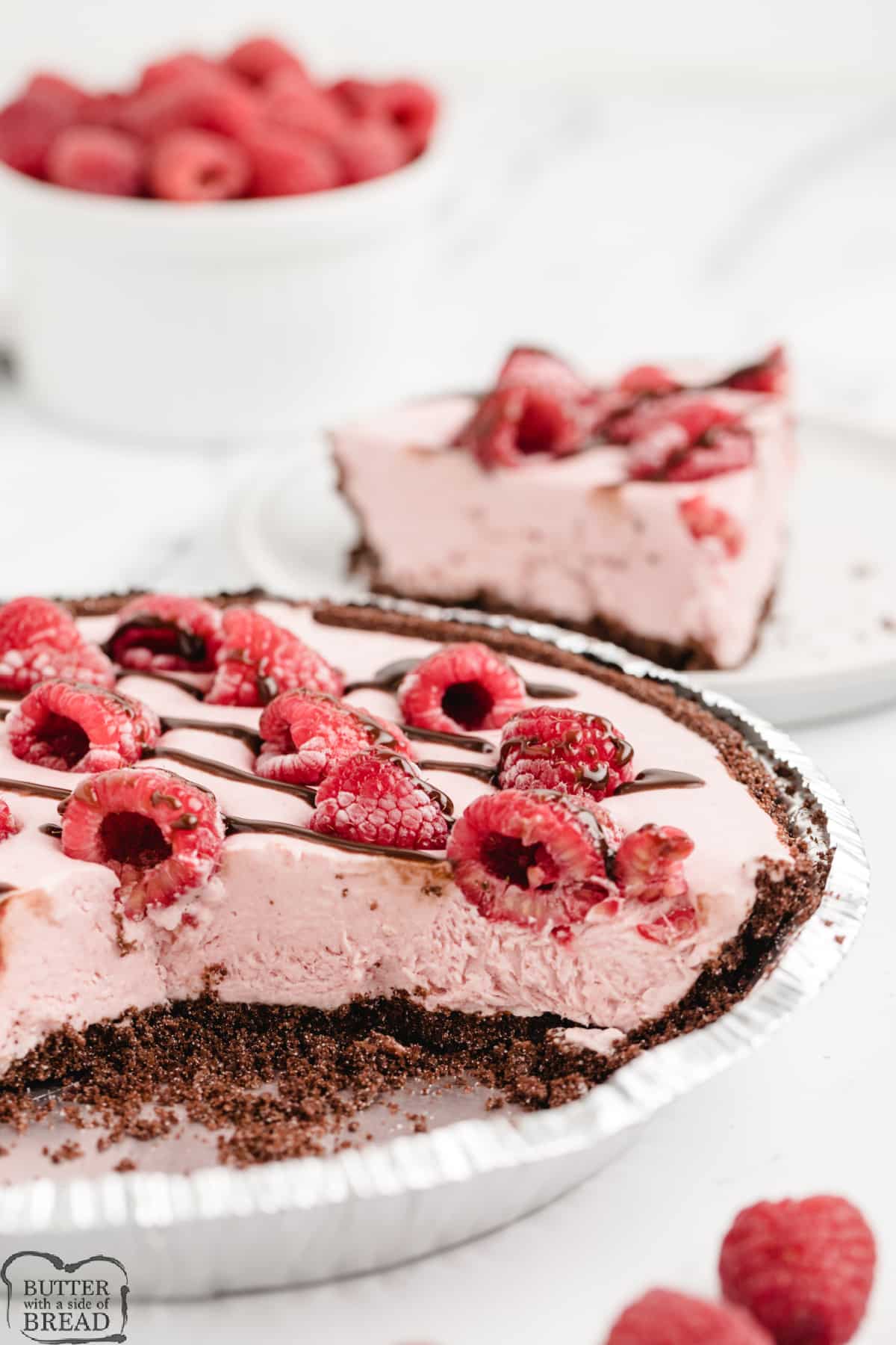 No-bake pie recipe with raspberries and whipping cream in a chocolate crust