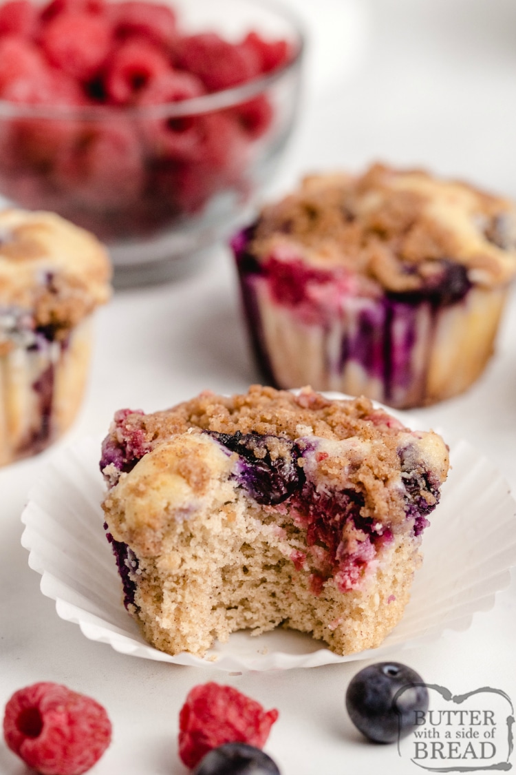 Double Berry Cheesecake Muffins are full of fresh blueberries and raspberries and have a delicious cream cheese filling in the middle! The brown sugar streusel topping adds even more flavor and a little bit of crunch!