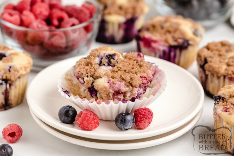 Double Berry Cheesecake Muffins are full of fresh blueberries and raspberries and have a delicious cream cheese filling in the middle! The brown sugar streusel topping adds even more flavor and a little bit of crunch!