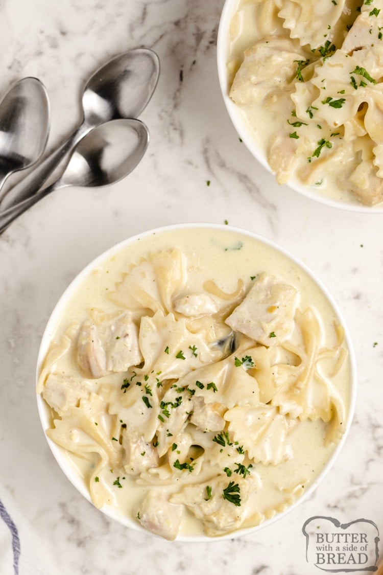 Slow Cooker Chicken Alfredo Soup is smooth, creamy and is made with simple, fresh ingredients. Chicken, milk, cream, garlic and cheese come together to make a soup that tastes just like your favorite alfredo dish...in a delicious soup recipe.