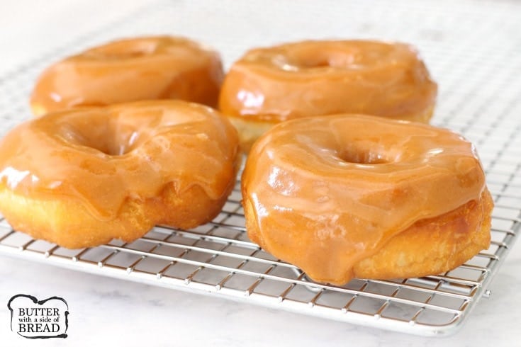 Pumpkin Spice Donuts made in minutes with crescent dough & an incredible pumpkin spice glaze. Hot &fresh donuts are easy to make & are a perfect Fall treat.