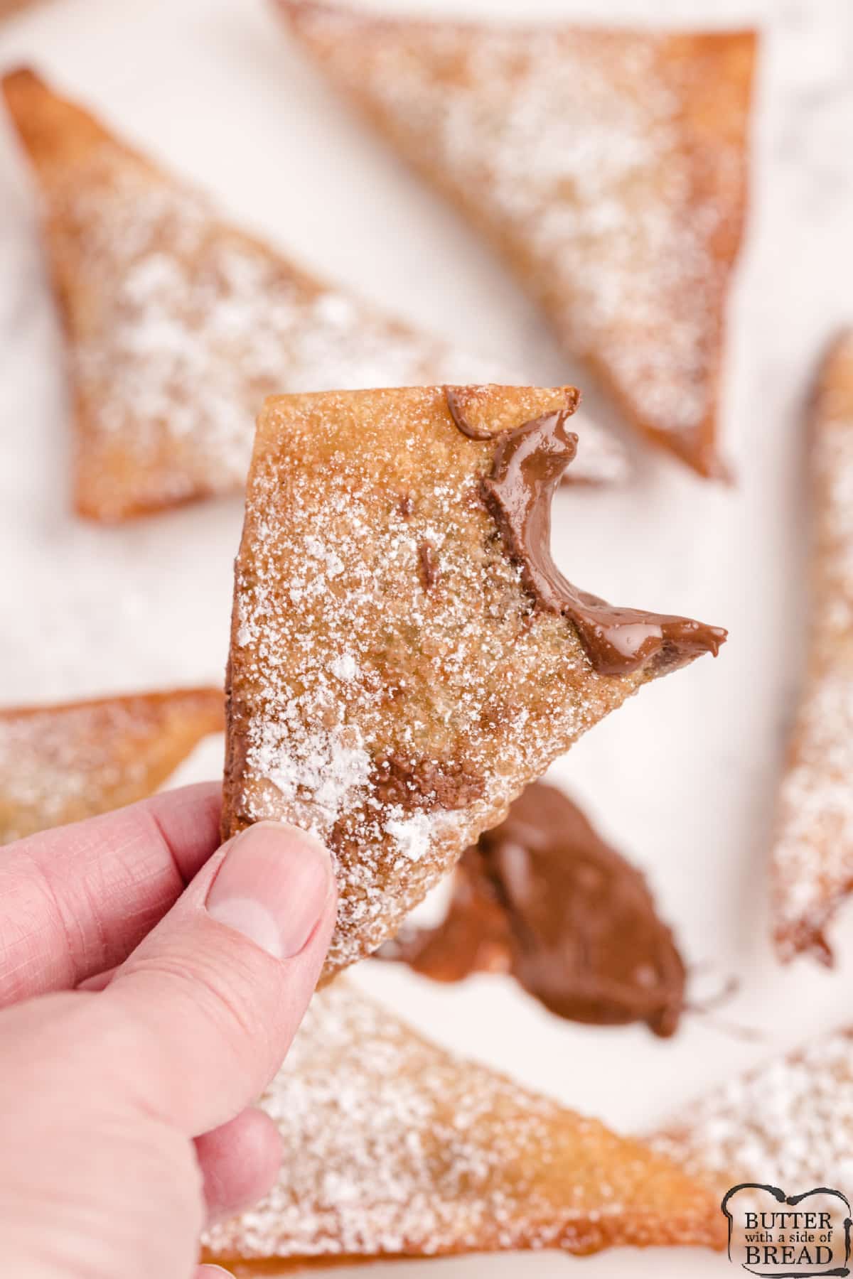 Nutella Wontons made with wonton wrappers and Nutella. Just a few simple ingredients needed to make these deliciously sweet fried treats! 
