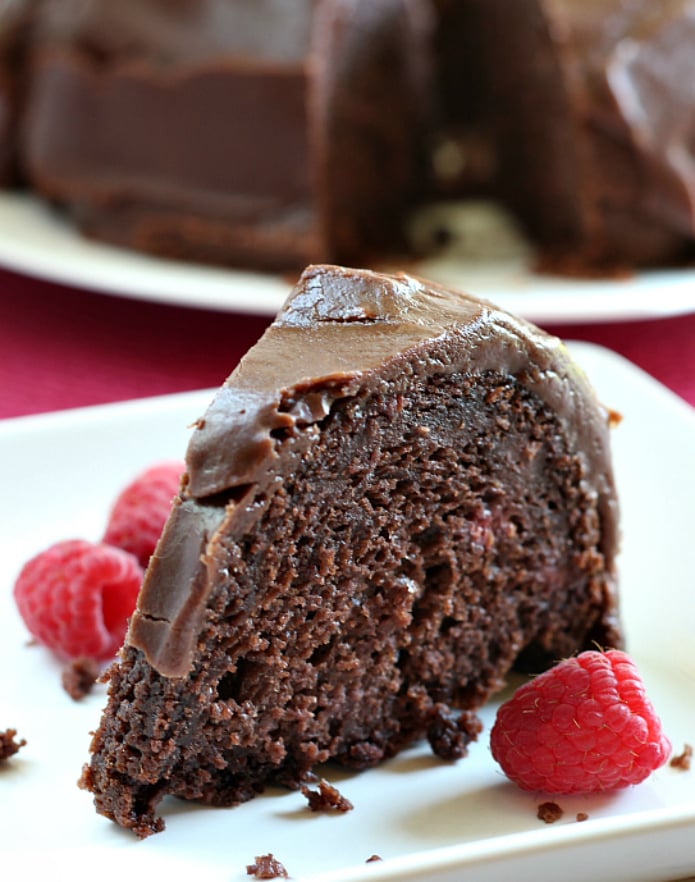 Chocolate Raspberry Cake is made with a cake mix and frozen raspberries and just a few more basic ingredients. This chocolate cake is topped with a simple and amazing chocolate ganache to create one of my favorite chocolate cake mix recipes!