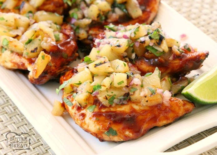 Grilled BBQ Chicken with Pineapple Salsa is made by smothering grilled chicken with thick & flavorful bbq sauce then topping it with a delicious pineapple salsa. Perfect for weeknight dinners or weekend get-togethers, the pineapple salsa pairs perfectly with the tangy grilled barbecue chicken.