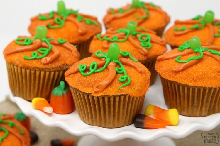 Pumpkin Muffins baked then topped with a simple glaze and orange sprinkles made to look like a cute pumpkin! Great pumpkin spice flavor & festive too! 