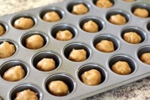 Peanut Butter Fudge Cups are the perfect dessert, starting with a peanut butter cookie base, and topped off with a delectable fudge filling!