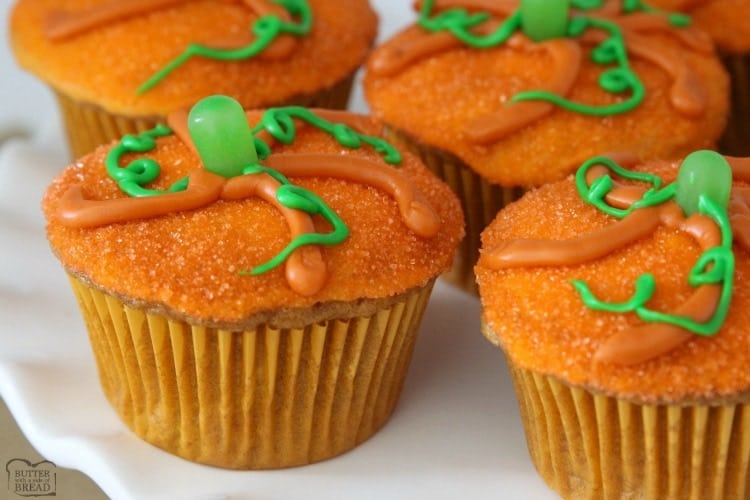 Pumpkin Muffins baked then topped with a simple glaze and orange sprinkles made to look like a cute pumpkin! Great pumpkin spice flavor & festive too!