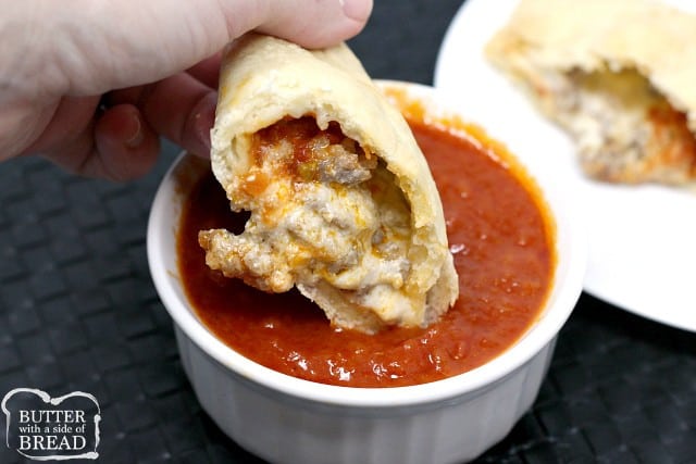 Cheesy Italian Sausage Calzones are a family favorite – homemade pizza crust filled with parmesan, mozzarella, ricotta, marinara sauce and juicy sausage!