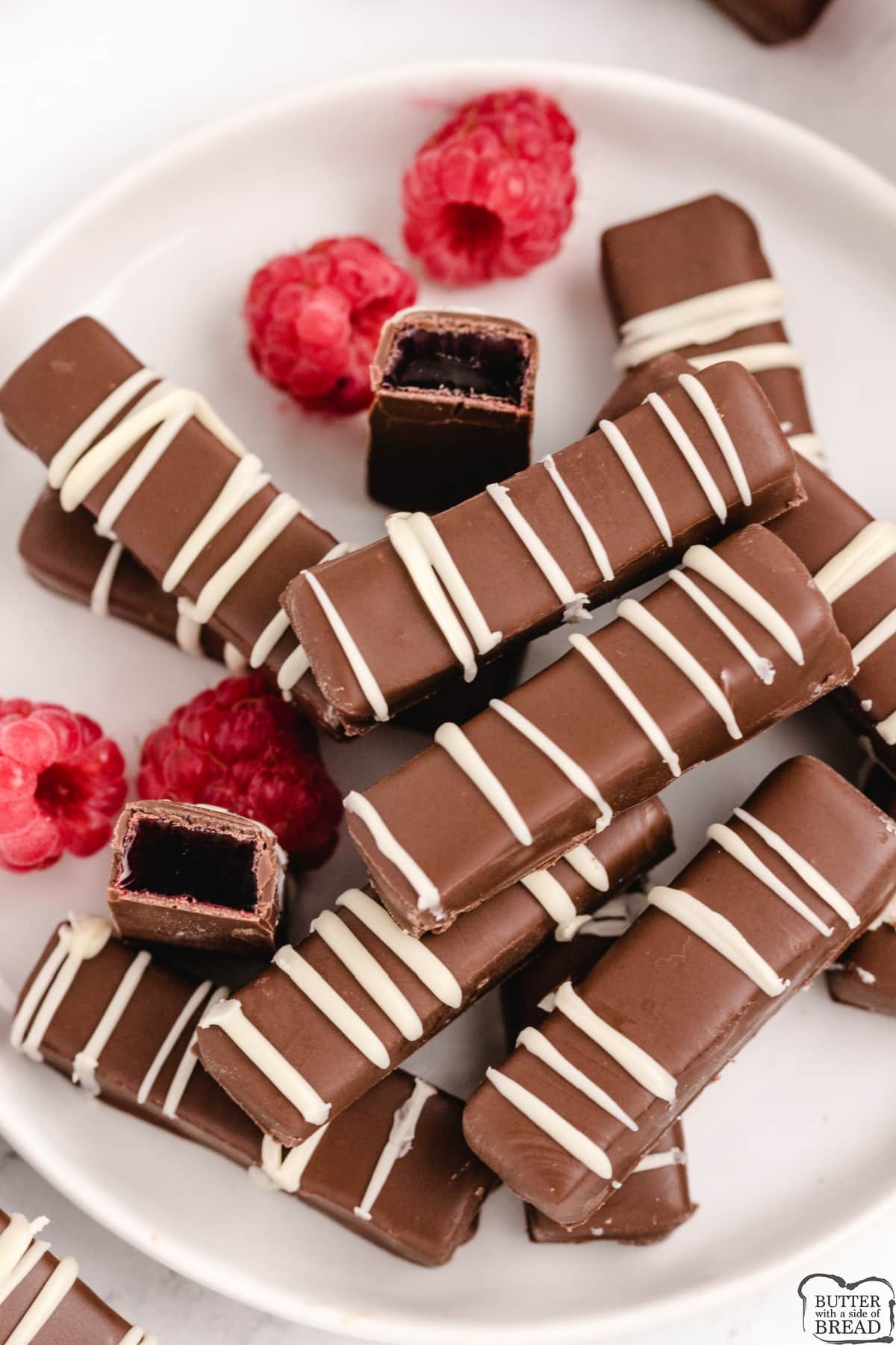 Chocolate Raspberry Sticks are made with a delicious raspberry jelly filling dipped in melted chocolate. Simple chocolate candy recipe that is so easy to make!