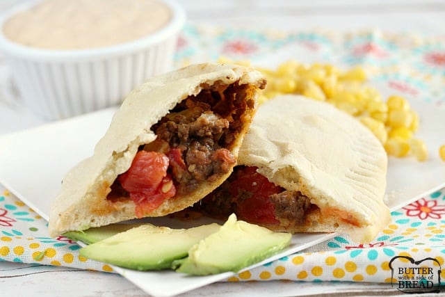 Easy Taco Calzones are made with a simple, homemade crust and then filled with ground beef, diced tomatoes, cheese and onions.