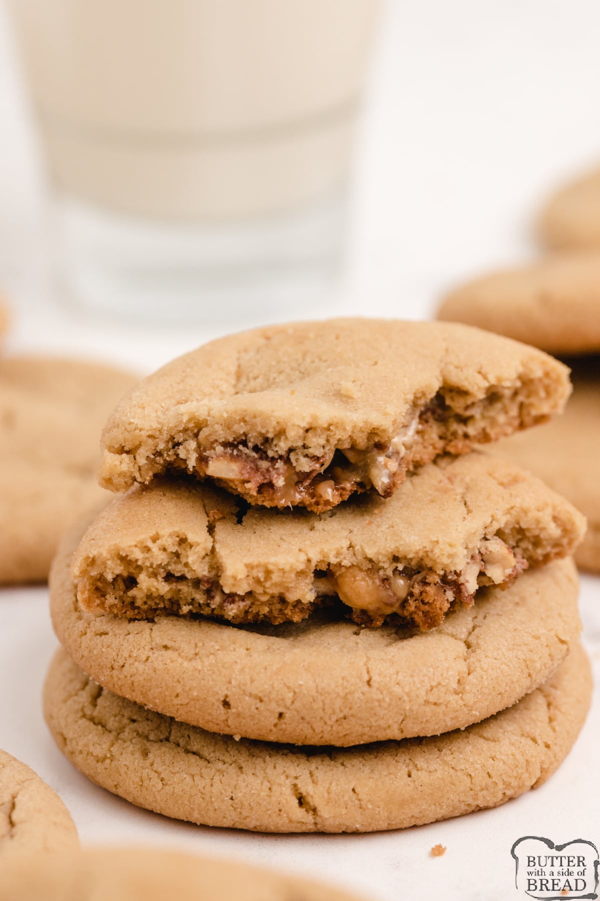 Snickers Peanut Butter Cookies start with an incredible soft and delicious peanut butter cookie recipe, and add a Snickers surprise in the middle!