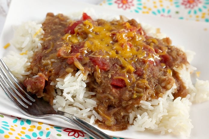 Slow Cooker Madras Lentils are full of red beans, lentils, tomatoes and can be served over rice for a delicious, healthy, vegetarian dinner the whole family will enjoy!