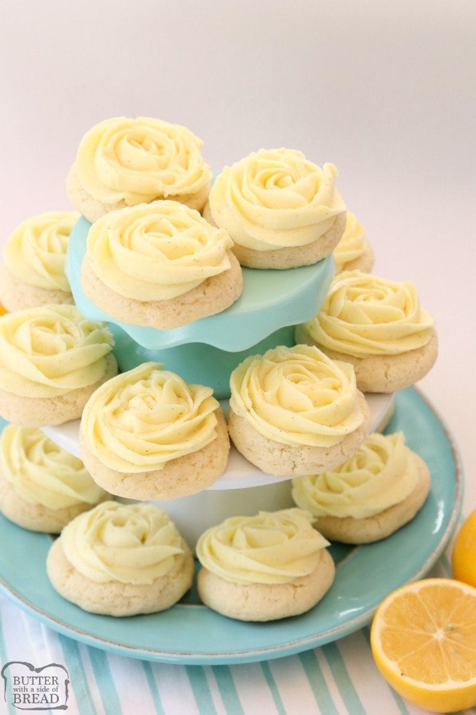 Lemon Sugar Cookies made with fresh lemon juice and zest in a soft sugar cookie dough and topped with a bright lemon buttercream frosting. Lemon Sugar Cookies are piped with a super simple rosette so they taste incredible and they're pretty too! No rolling and chilling necessary- just scoop, bake, cool and frost.