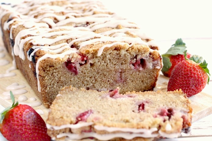 Glazed Strawberry Bread is a delicious, moist quick bread that is made with fresh strawberries and a touch of cinnamon too! The frosting is made with strawberry cream cheese for a little bit of extra strawberry flavor!