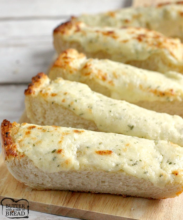 Easy Cheesy Garlic Bread is loaded with butter, cream cheese, garlic, parsley and mozzarella- it's the perfect side dish for every Italian meal!