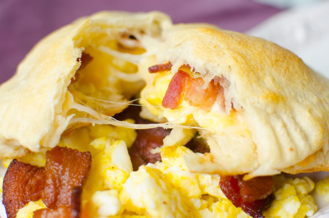 Canned crescent roll dough baked with scrambled eggs, bacon and cheese inside to make a convenient breakfast.