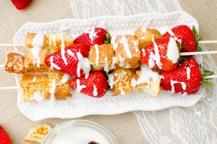 French Toast Kabobs are French toast bites stacked onto a kabob with fresh, ripe strawberries drizzled with a vanilla glaze. French toast recipe 