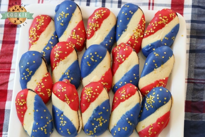 Super Simple 4th of July Cookies made with just 4 ingredients and NO BAKE! Easy red, white and blue cookies made with Milano cookies dipped in red and blue melting chocolate then sprinkled with gold stars. Made in just 15 minutes and theyâre perfectly patriotic!