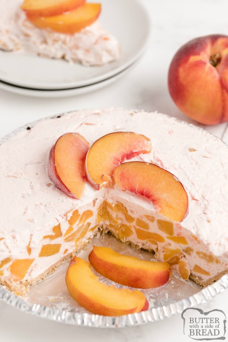 Creamy Peach Pie is made with only 5 ingredients in less than five minutes! Peach Jell-O, vanilla ice cream and fresh peaches are combined into a delicious, no-bake pie recipe!