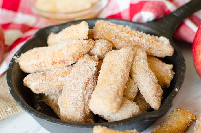 Apple Pie Fries are small strips of apple pie with a flaky crust and a simple applesauce filling. The Apple Pie Fries are fried and then tossed in cinnamon and sugar to complete this sweet, Fall time dessert.