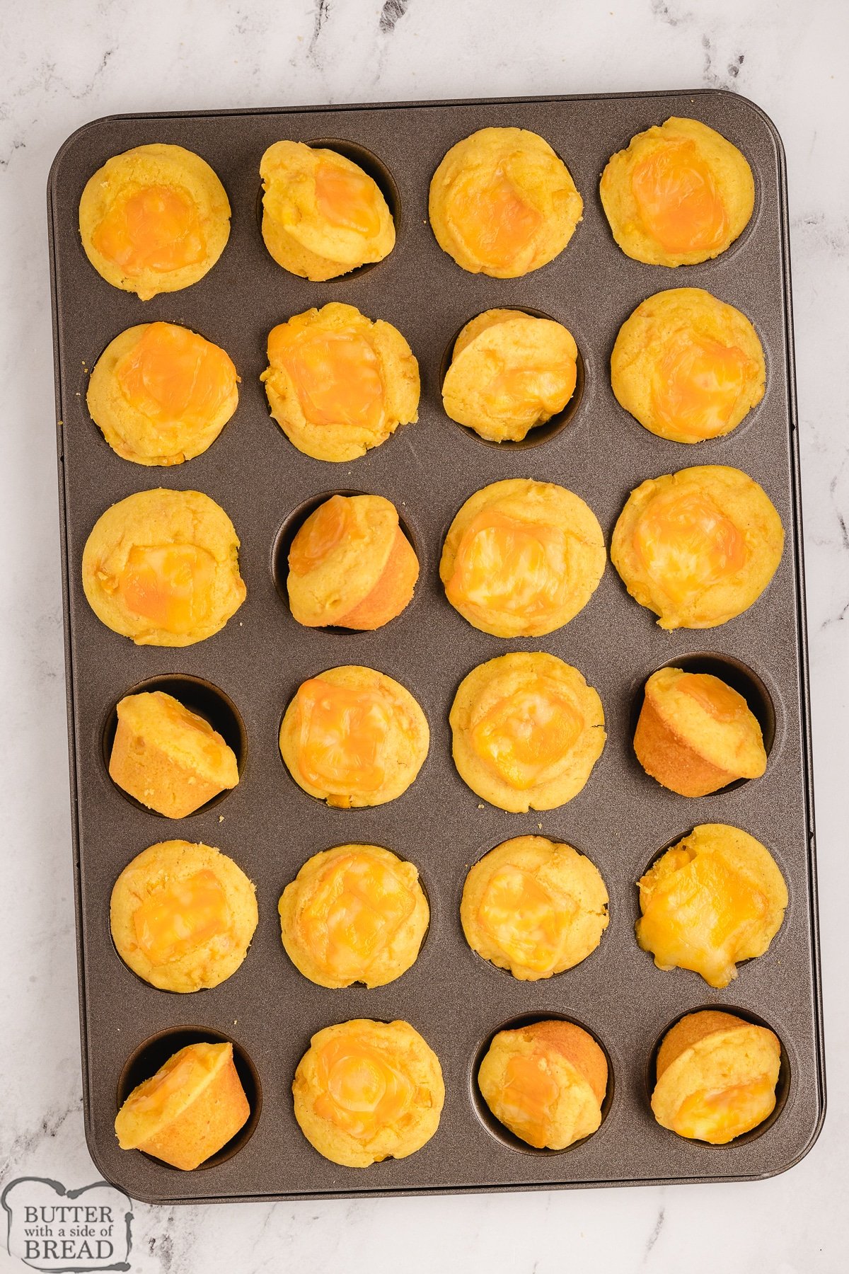 mini cornbread muffins in a muffin tin