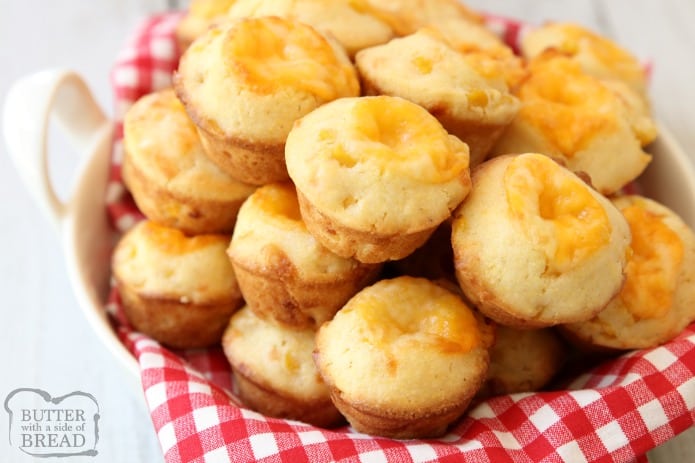 Cheesy Cornbread Muffins are delicate, flavorful honey cornbread with a cheddar cheese addition! Fun, bite-sized mini cornbread muffins are perfect for accompanying lunch or dinner any time of the year!
