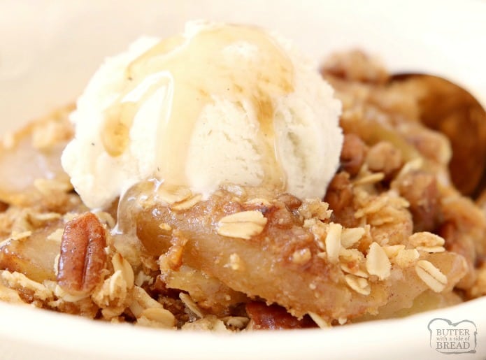 Maple Pecan Apple Crisp made with oats, pecans, brown sugar, butter and apples in a perfect Fall dish bursting with fresh apple flavor! Topped with real maple syrup, this apple crisp recipe is our all-time favorite!