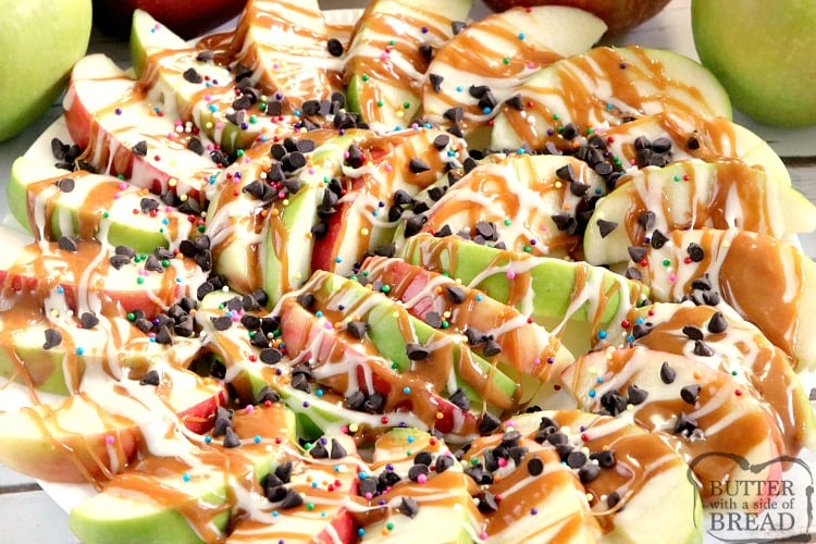 Caramel Apple Nachos are easily made by topping sliced apples with caramel, melted marshmallows, chocolate chips and sprinkles! This fun variation of a traditional caramel apple recipe is easier to share and easier to eat too!