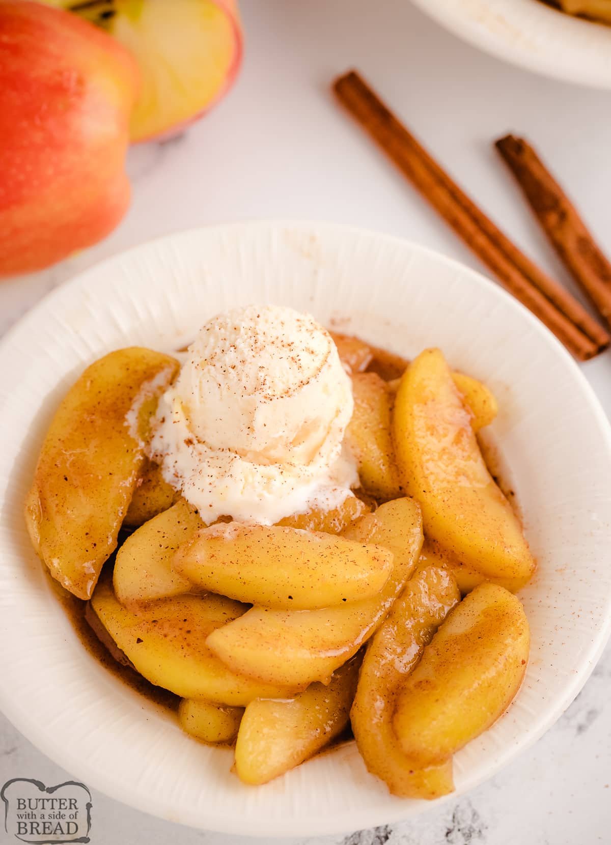 cinnamon apples in a bowl with ice cream