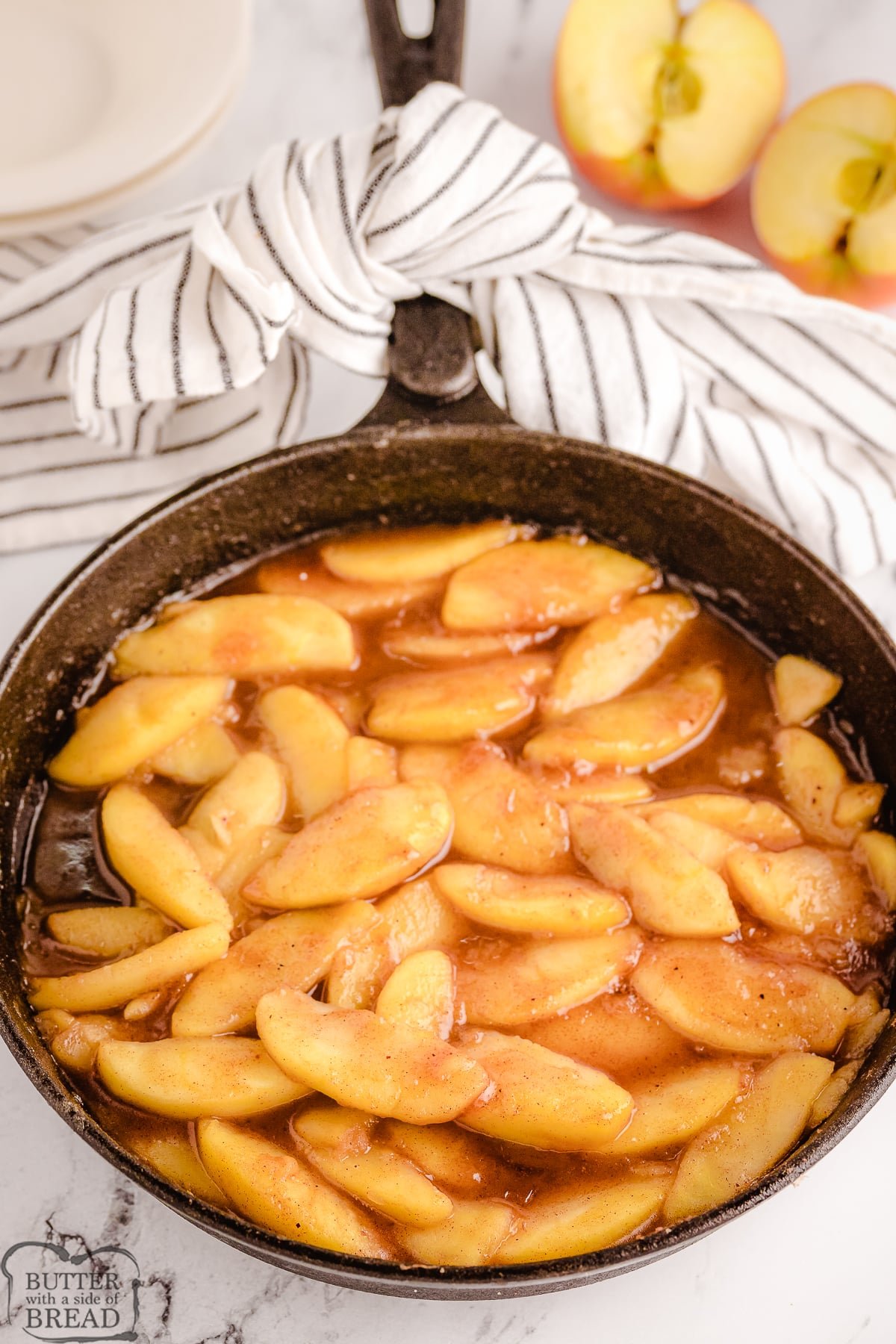 fried cinnamon apples in a cast iron skillet