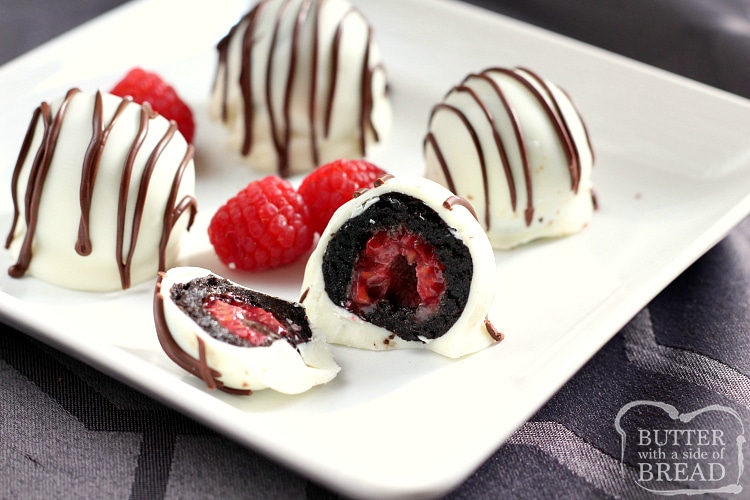White Chocolate Raspberry Oreo Balls are a delicious no-bake treat made with Oreo cookies, cream cheese and a raspberry in the middle! These Oreo Balls are dipped in a white chocolate candy coating and coated with a chocolate drizzle.