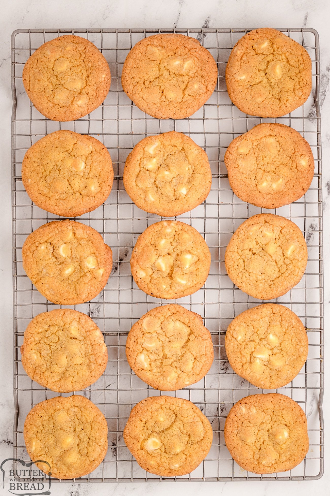 buttery white chocolate cookies on a cooling rack