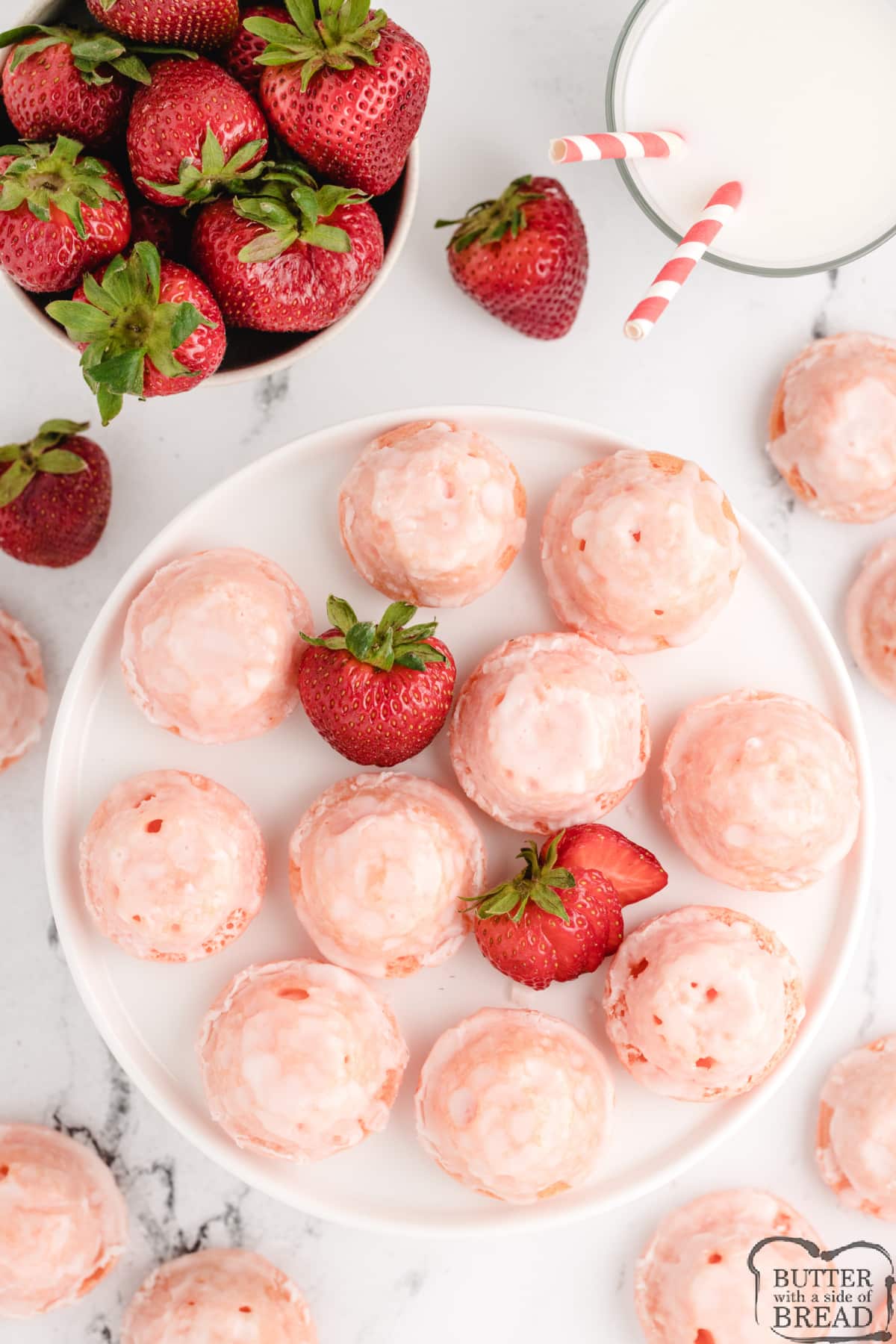 Glazed Mini Strawberry Cupcakes are delicious bite-sized treats that start with a strawberry cake mix. The easy strawberry glaze soaks into the bottoms to make these little cupcakes even more incredible.