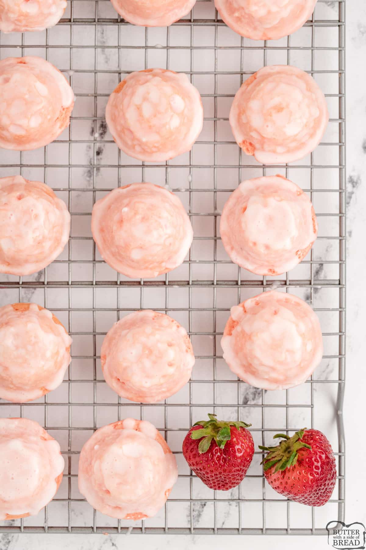 Mini strawberry cupcakes dipped in glaze