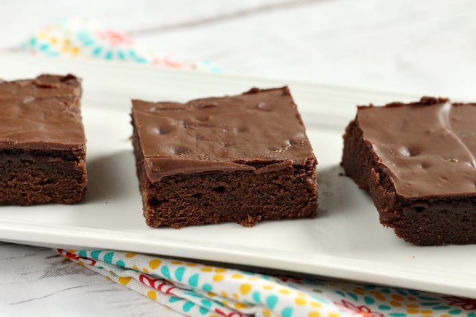 Easy Brownie Recipe with only 5 ingredients and then topped with Hershey bars for the easiest frosting ever! This chocolate dessert is a classic favorite and this is by far the easiest brownie recipe I've ever made without using a mix! 