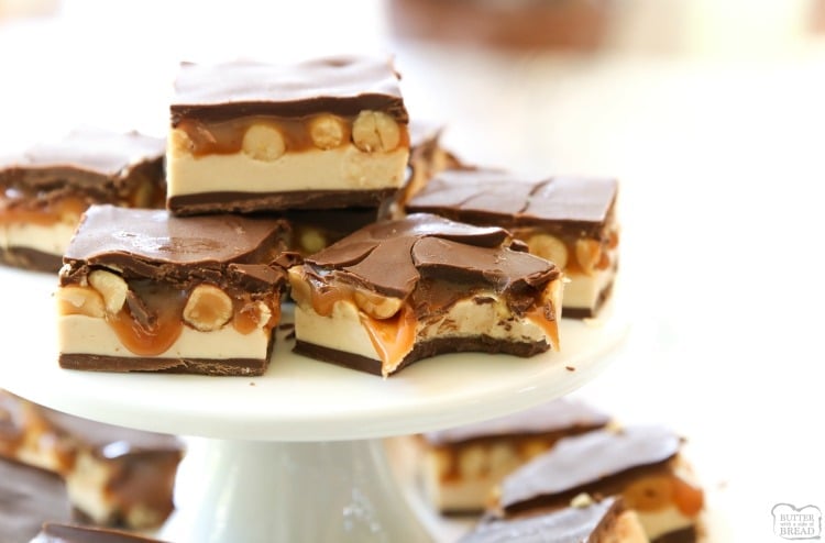 Snickers Bars made from scratch with creamy caramel, easy nougat, peanuts and chocolate. Make a whole pan of your favorite candy bar to share!