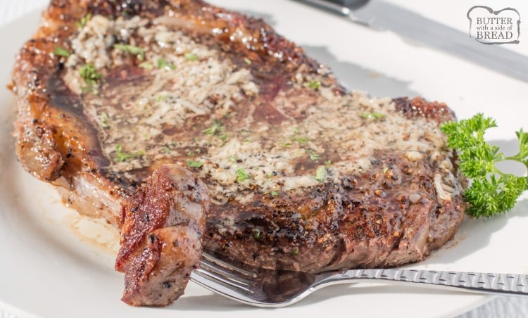Simple recipe for Pan-Fried Steak topped with garlic butter that everyone raves about! Done in 15 minutes & easily the BEST recipe for steak cooked on a stove EVER.