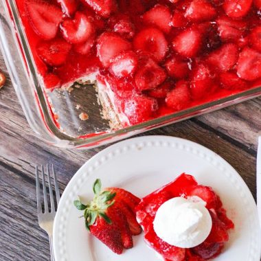 Gorgeous Strawberry Pretzel Salad layered with a buttery pretzel crust, cream cheese whipped topping, strawberries and jello. A simple sweet side dish that is always the first to go!