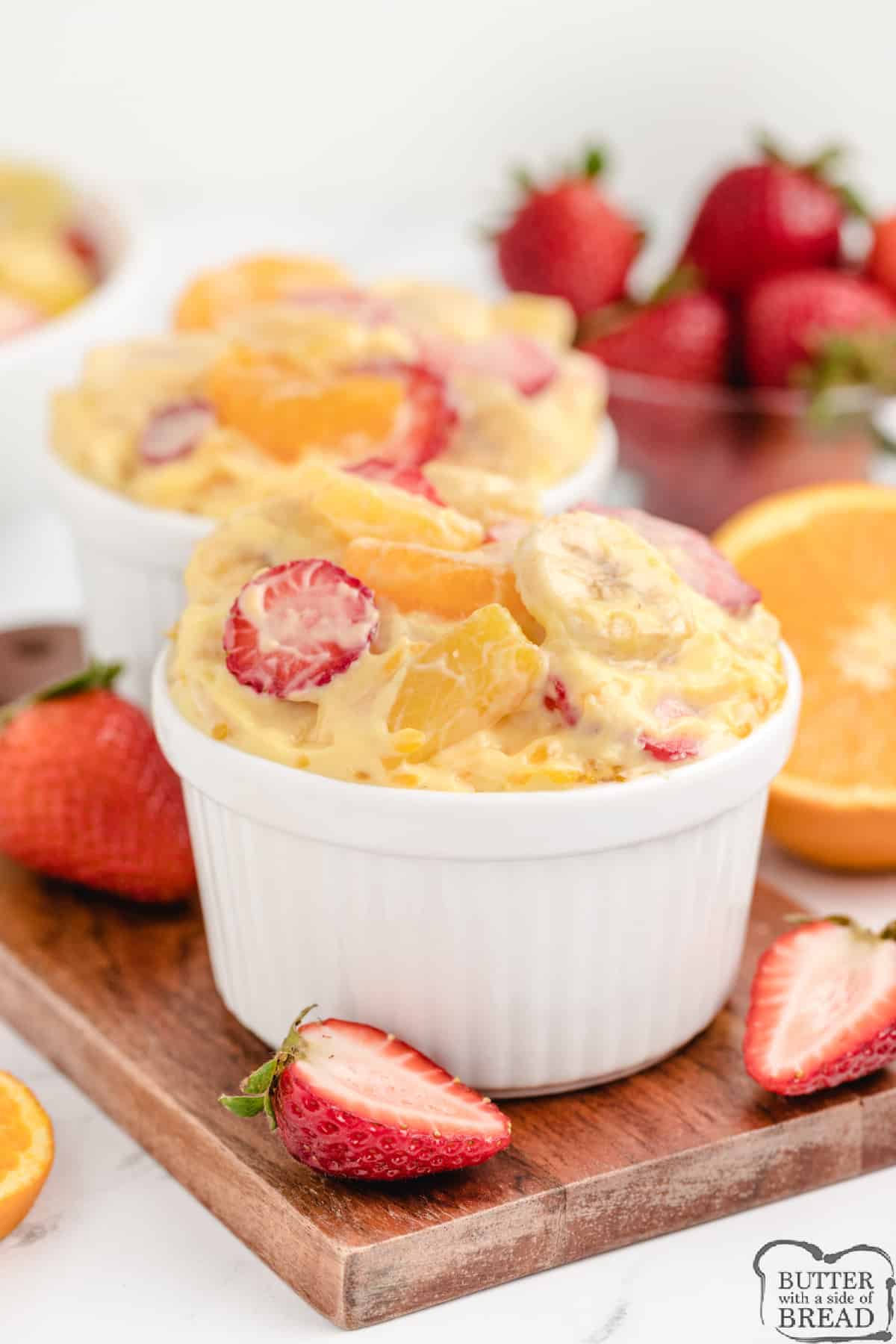 Vanilla Orange Fruit Salad is a simple fruit salad that makes the perfect side dish for any meal! This delicious fruit salad recipe is full of pineapple, oranges, strawberries and bananas coated with a vanilla pudding and yogurt glaze.