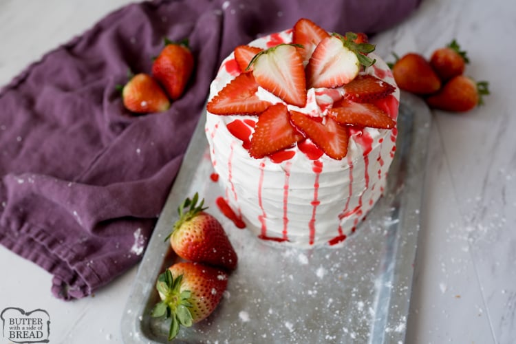 Strawberry Shortcake Cake is a gorgeous vanilla cake filled with whipped vanilla frosting and fresh strawberries. Strawberry Cake made easy with a box cake mix & a spectacular whipped frosting!