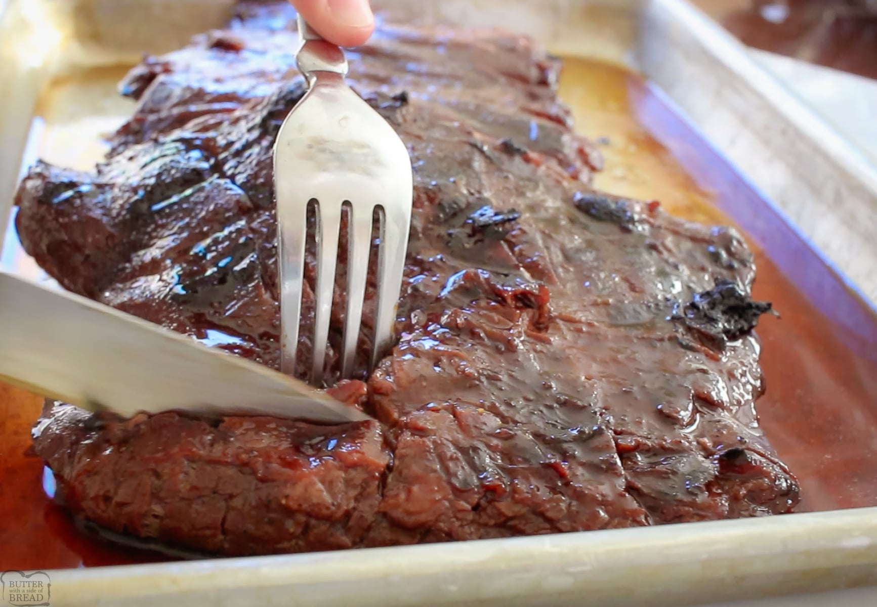 marinated steak being sliced