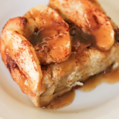 Slice of apple bread pudding with caramel sauce