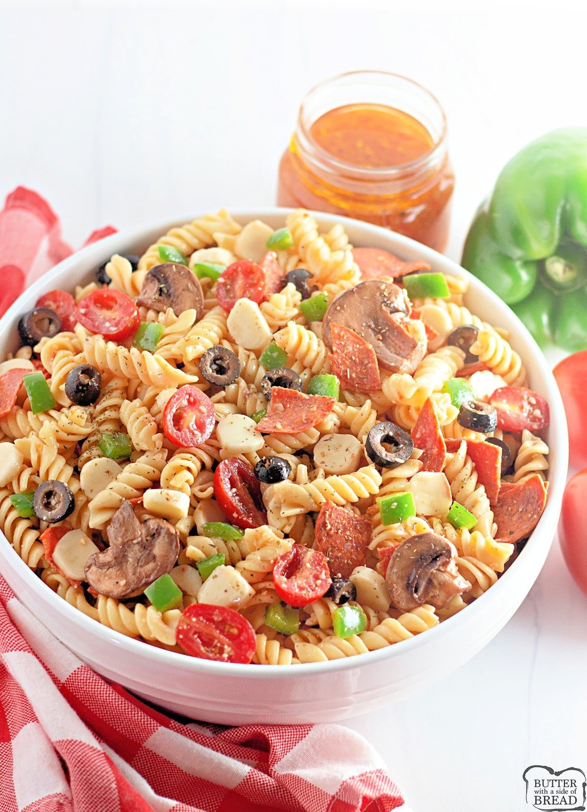 Pizza Pasta Salad is easy to make and full of pepperoni, mozzarella cheese, olives and all of your other favorite pizza toppings. This cold pasta salad recipe is perfect for parties and potlucks or even just a simple weeknight dinner. 