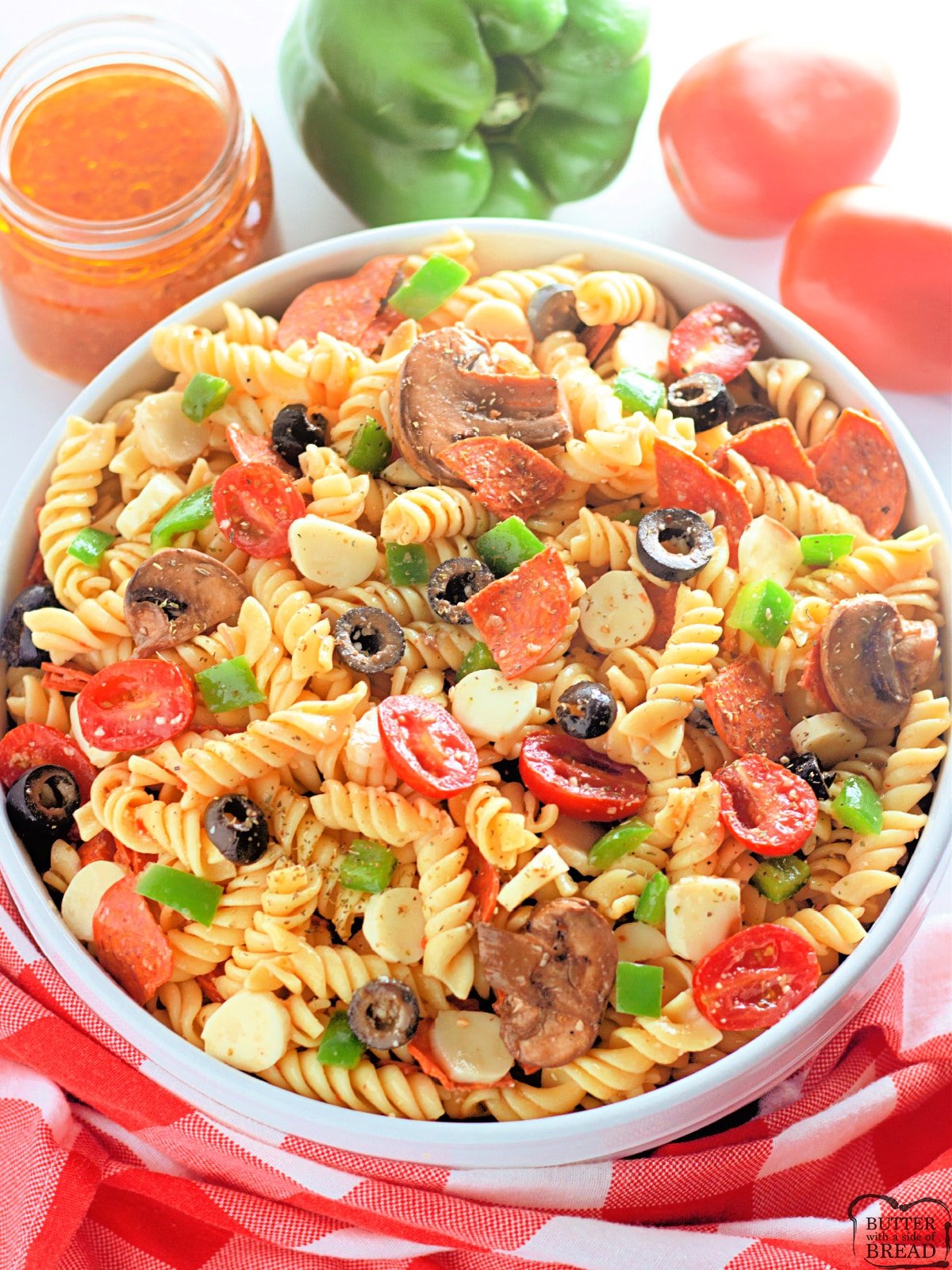 Cold pasta salad recipe with tomatoes, pepperoni, mozzarella, olives and peppers
