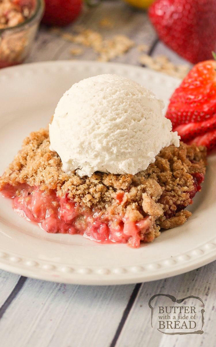 Strawberry Crisp filled with sweet, juicy strawberries & topped with crunchy cinnamon oats.  Easy strawberry crisp recipe made fast and perfect served with vanilla ice cream. 