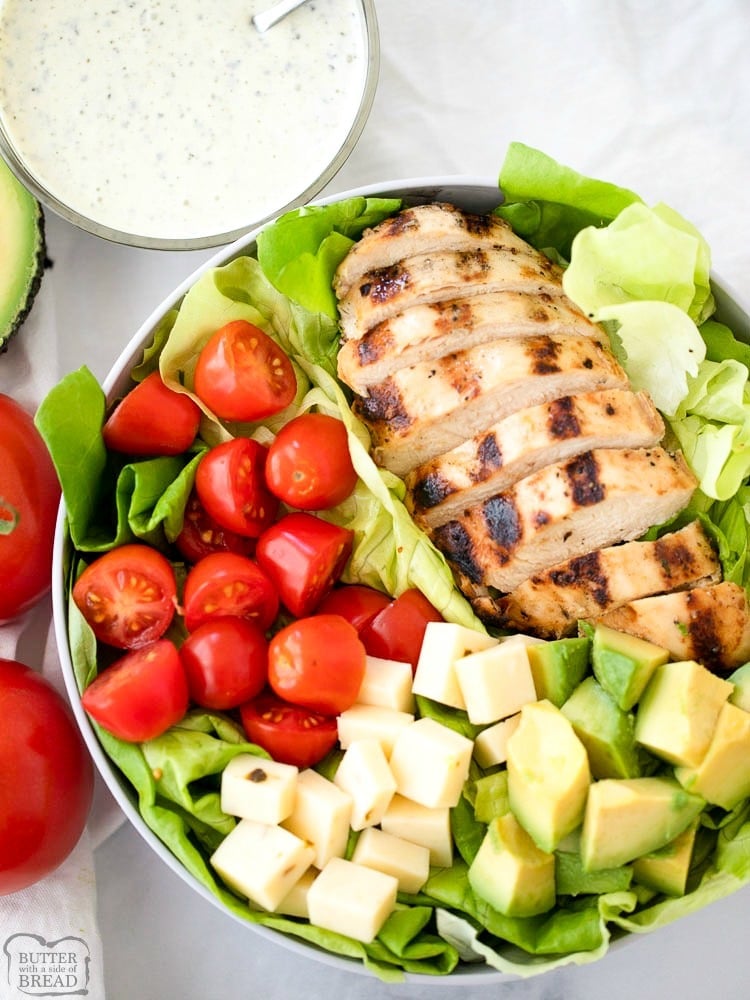 This Grilled Chicken Salad Recipe with Pesto Ranch Dressing is a quick and easy grilled chicken salad recipe.  It includes a simple grilled chicken marinade recipe that makes the most tender and juicy grilled chicken and a delicious pesto ranch dressing everyone will love.  