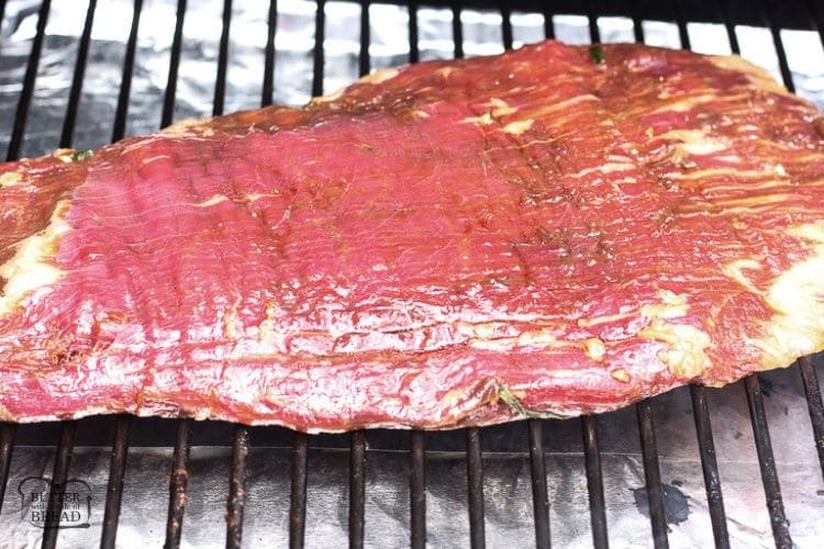 marinaded flank steak on a grill