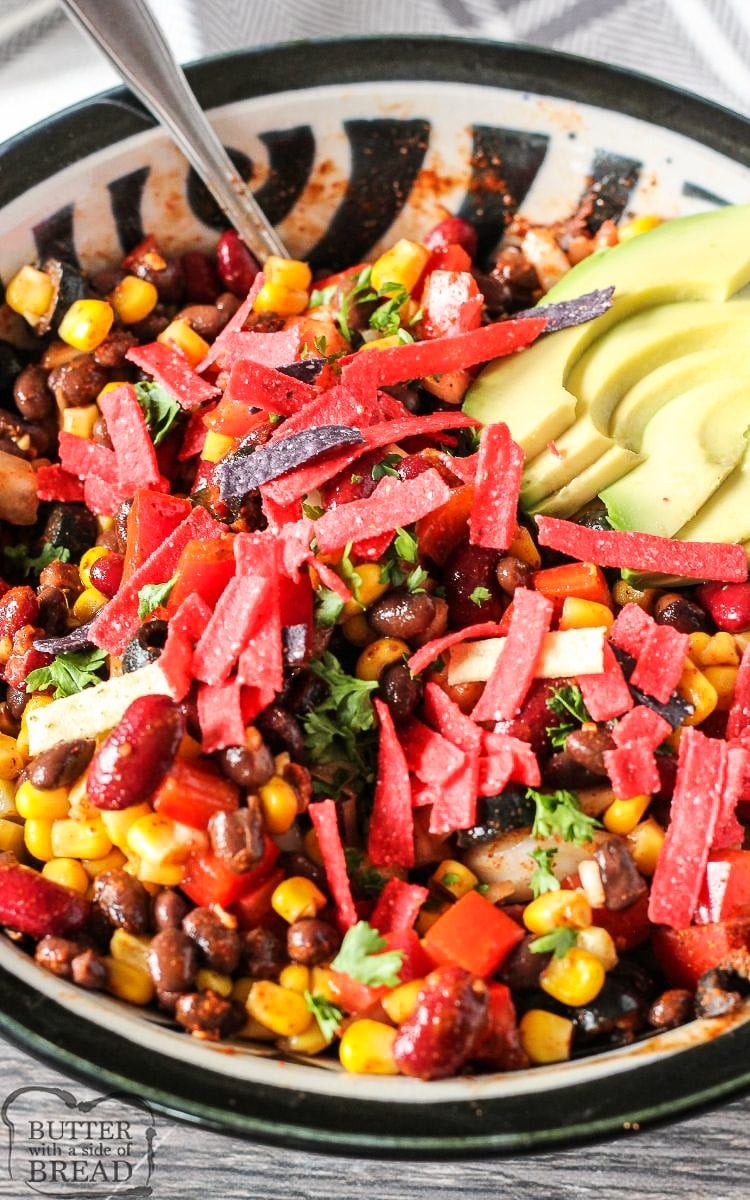 Easy Taco Salad Recipe loaded with beans, corn, peppers, onions, tomatoes and perfectly seasoned! Simple vegetarian taco salad to whip up for an easy dinner or for a potluck!