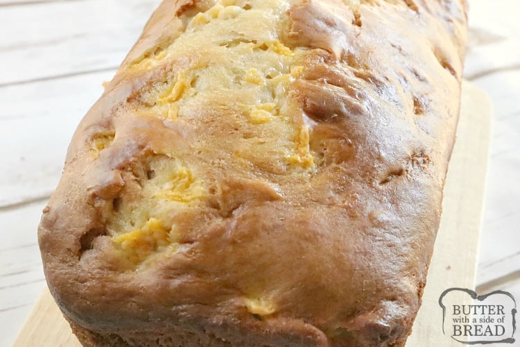 Peaches and Cream Bread is an easy quick bread that is moist, sweet, full of fresh peaches, and then topped with a simple vanilla glaze. This easy bread recipe is a great way to use up all of those peaches that are so delicious right now!